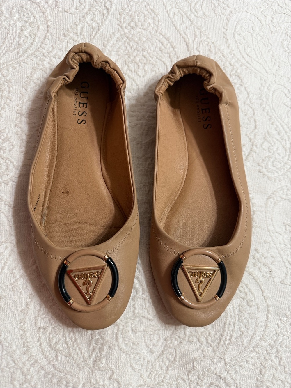 Guess Tan Ballet Flats Size 7.5M with Black & Gold Logo Ring Accent